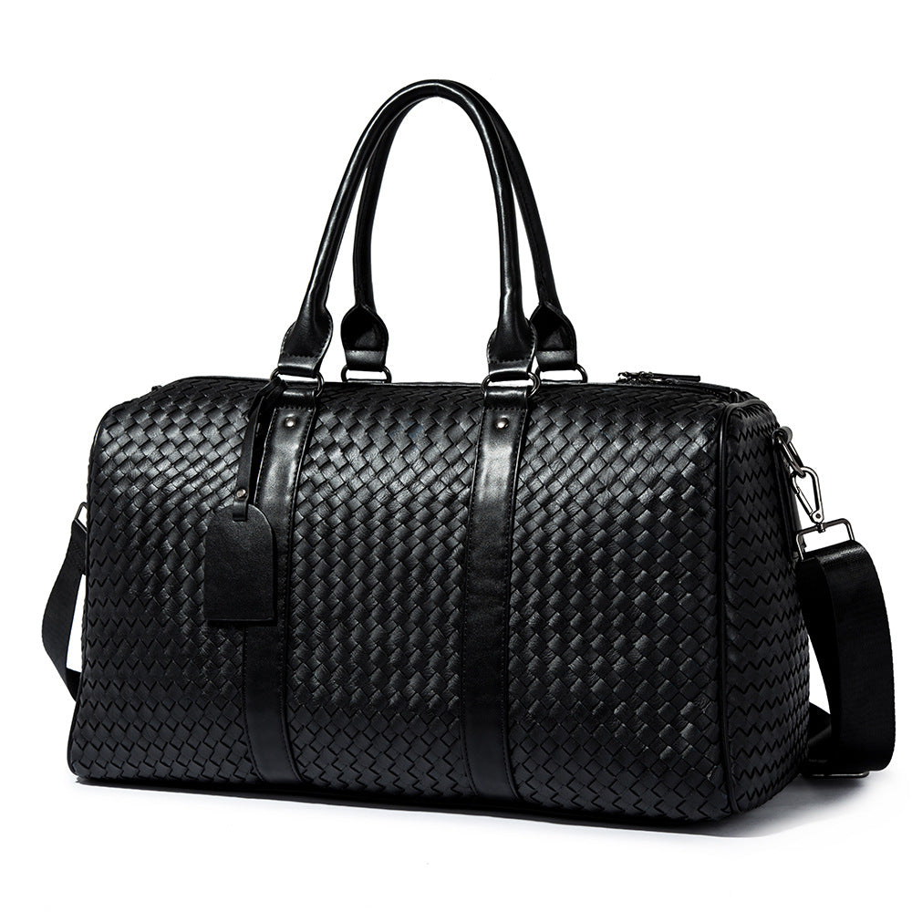 Spot printemps nouveau sac de voyage neutre de style européen et américain affaires portable grand sac couleur unie sac tissé à la main à une épaule